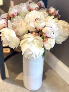 Image of pink and white flowers in a white vase