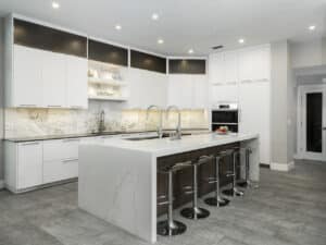 Image of a kitchen with a marble backsplash.