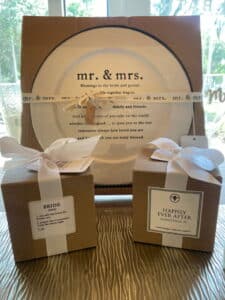 A sweet newly wedding gift that includes a plate and nice candles!