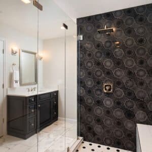 Luxury master bathroom with black and gold accents.